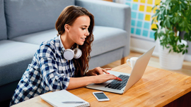 young woman working at a laptop