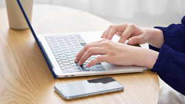 Close up of someone typing on a keeyboard