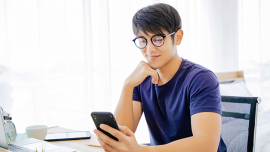 Boy looking at his mobile phone