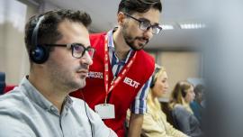 A person sitting IELTS in a test centre