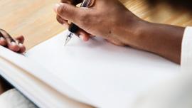 writing in a note pad